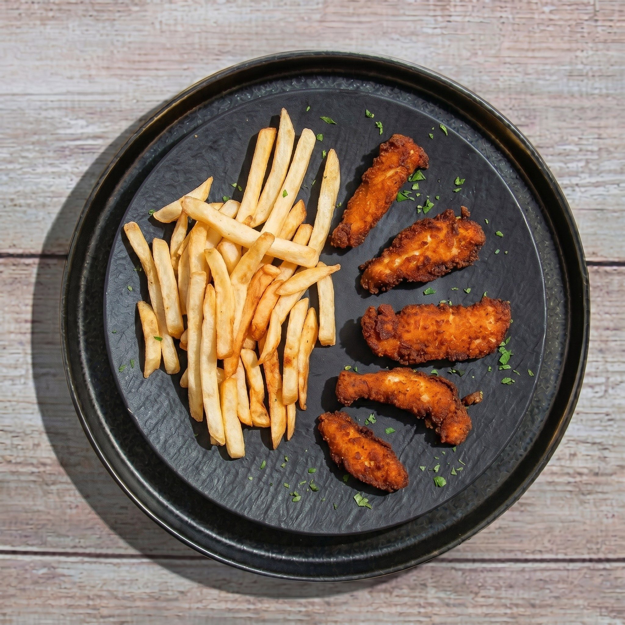 Hand-Breaded Chicken Strips / Chicken Fingers.